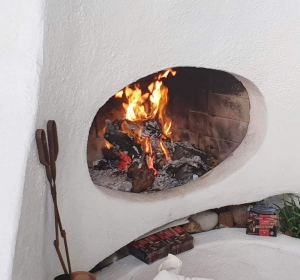 Wood fireplace at downstairs nook