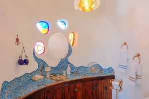 Downstairs bathroom with stained glass and mosaic counter